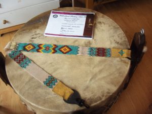 Matricia Bauer, Indigenous artist, beader, beadwork, drum maker, drums, hats, jewellery, moccasins, painter, painting, first nations, indigenous arts collective of canada, pass the feather.