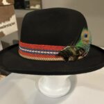 Ronald Joseph Kerr Black hat with ribbon and peacock feather