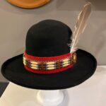 Ronald Joseph Kerr Black hat with ribbon, beads, and white feather