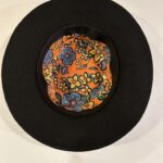 Ronald Joseph Kerr Top of Black hat with floral design