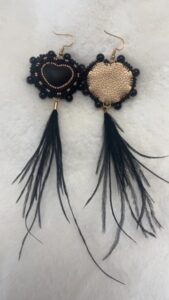 Jordyn-Allen-Black heart earrings with feathers