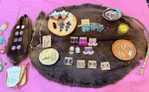 Lisa Roundpoint - Little Bear Design table assorted with jewelry