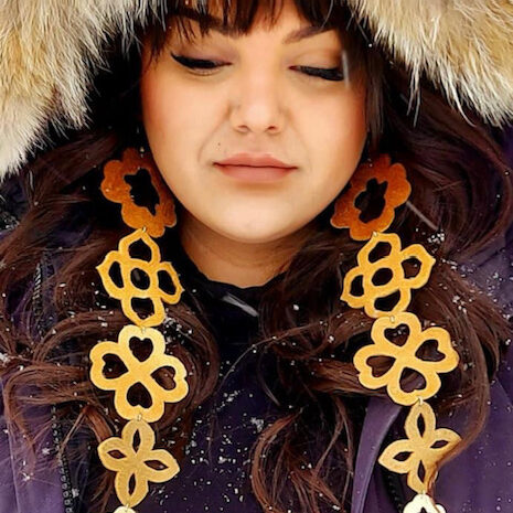 Crystal Behn- Long Hide Earrings on an Indigenous woman