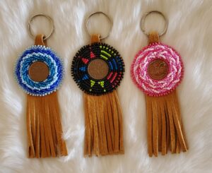 Beth Queau, crafts, beadwork, feathers, medicine bags, jewelry, pop sockets, keychains, purses, Indigenous Artist, First Nations, Indigenous Arts Collective of Canada, Pass The Feather