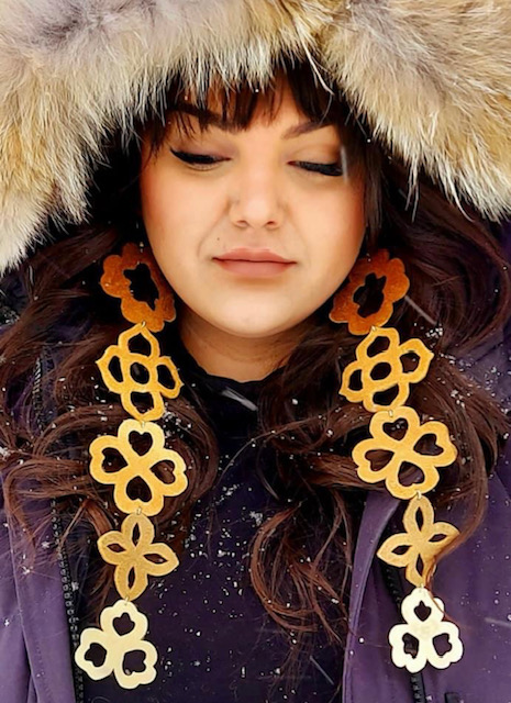 Crystal Behn- Long Hide Earrings on an Indigenous woman